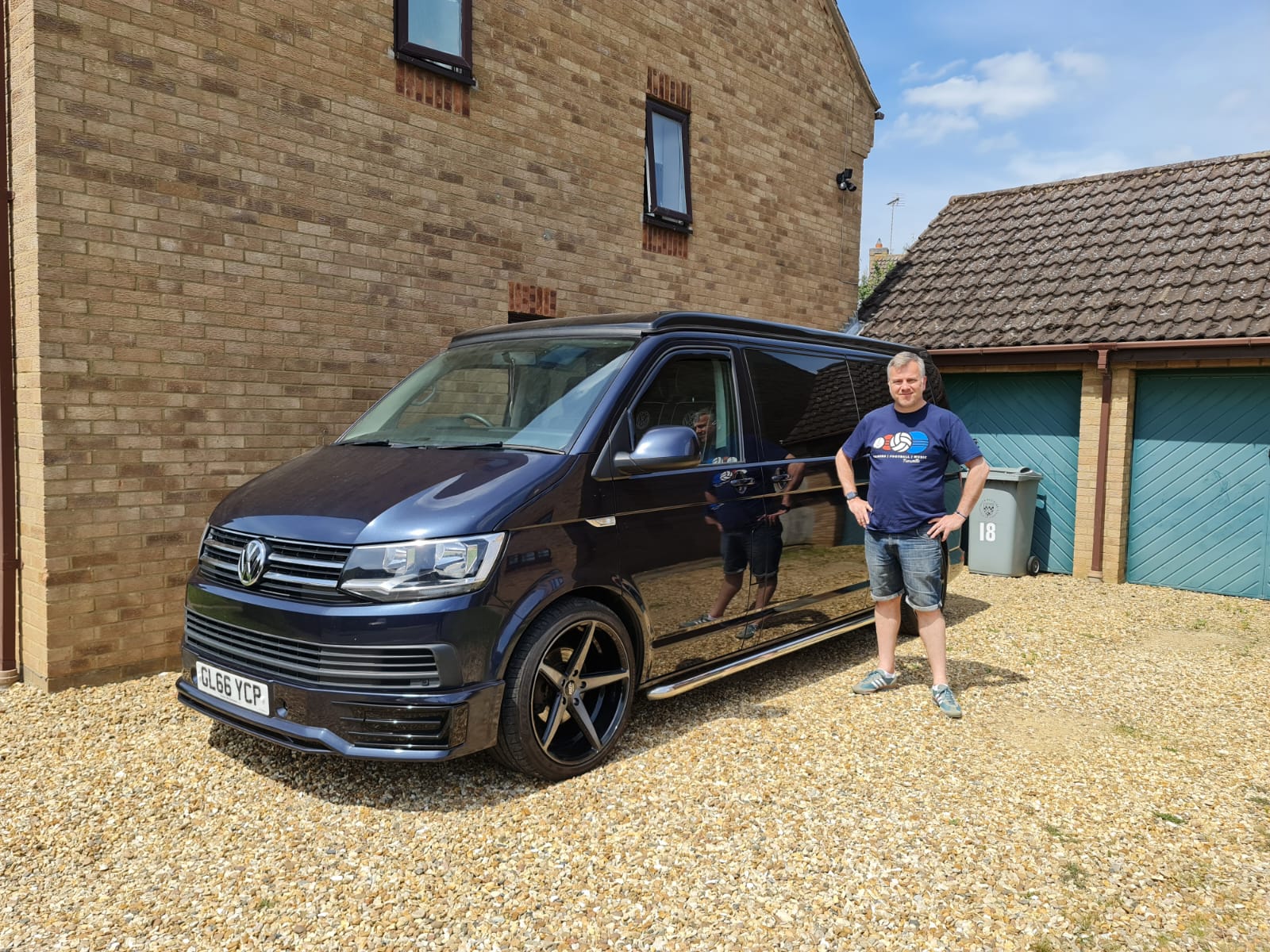 Winner Mark East of a VW T6 in Midnight Starlight Blue - DSG Off Grid with Pop Top - with Inflatable Awning - 1st June